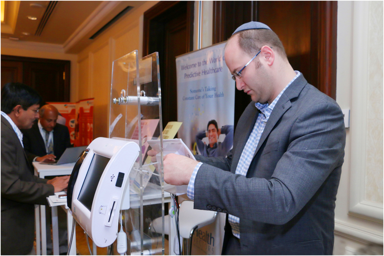 Attendee visiting a booth at the summit.