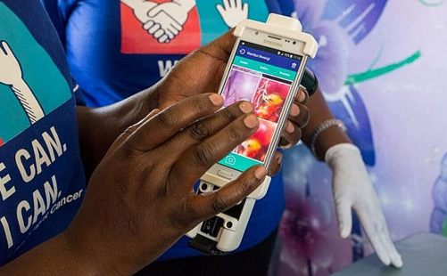 Healthcare worker using FDA-cleared smart mobile colposcope.
